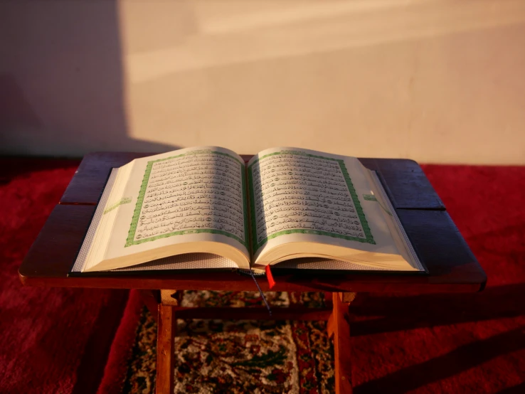 an open book sitting on top of a table