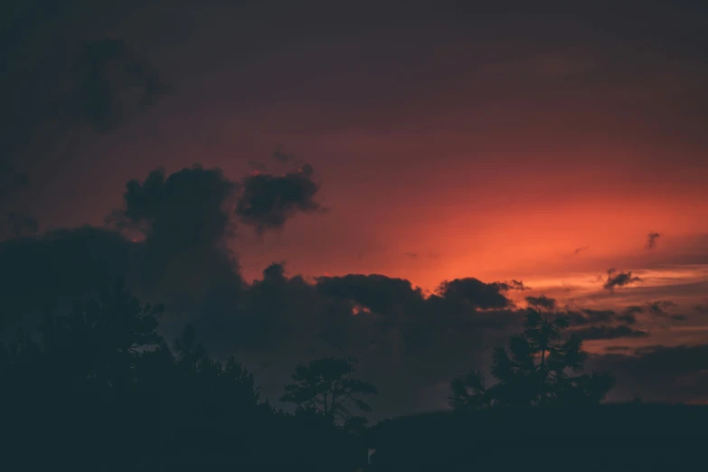 a view of a dark sky as the sun sets