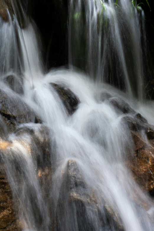 a small waterfall with some little waterfalls over it