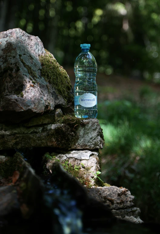 a water bottle on top of some rocks