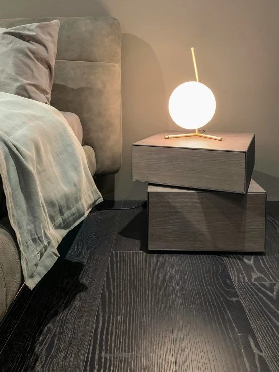 a modern style lamp on wooden nightstands