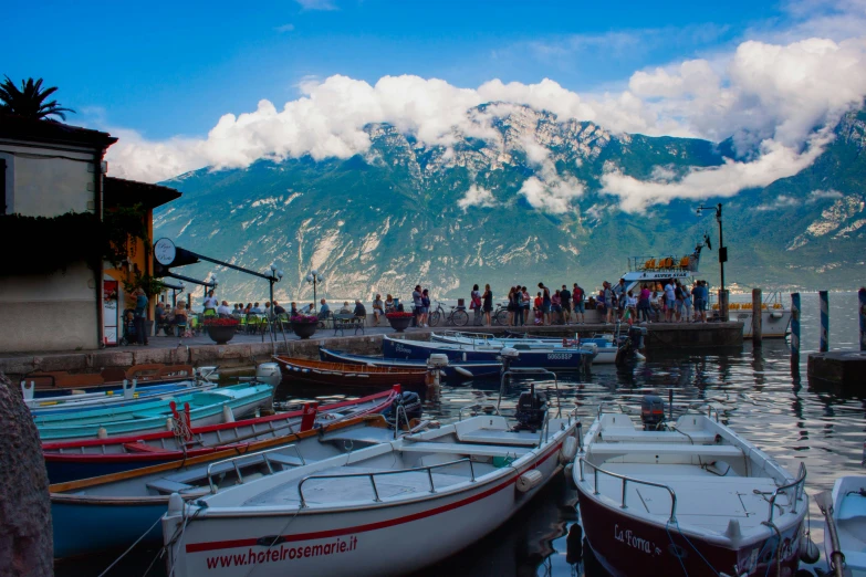 some people standing around on a pier