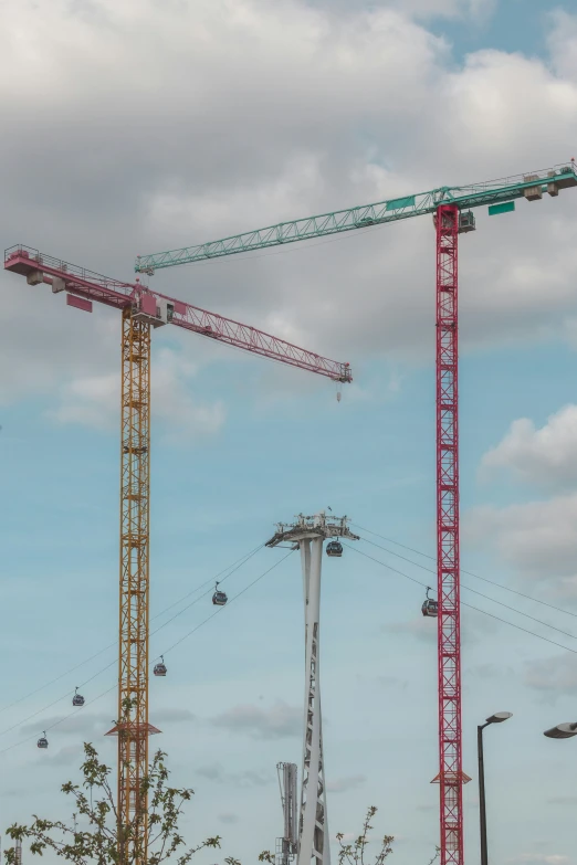 a view of a crane and two other cranes
