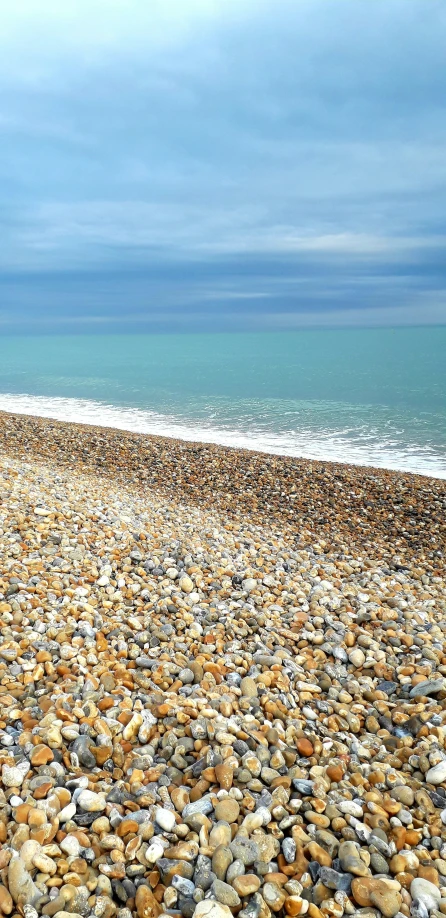 an open area with a beach and a lot of stones