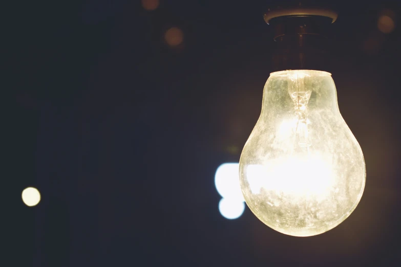 a glowing light bulb with a black background