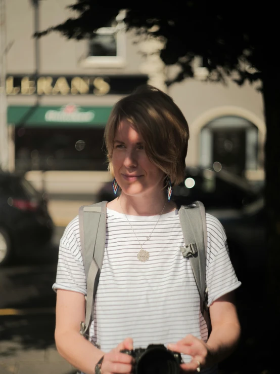 a woman holding her camera looking at the pographer