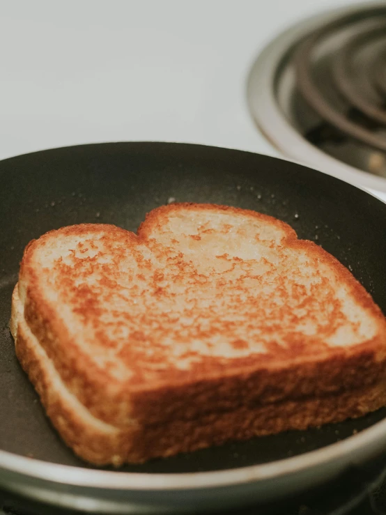 a toasted piece of bread sitting in a pan