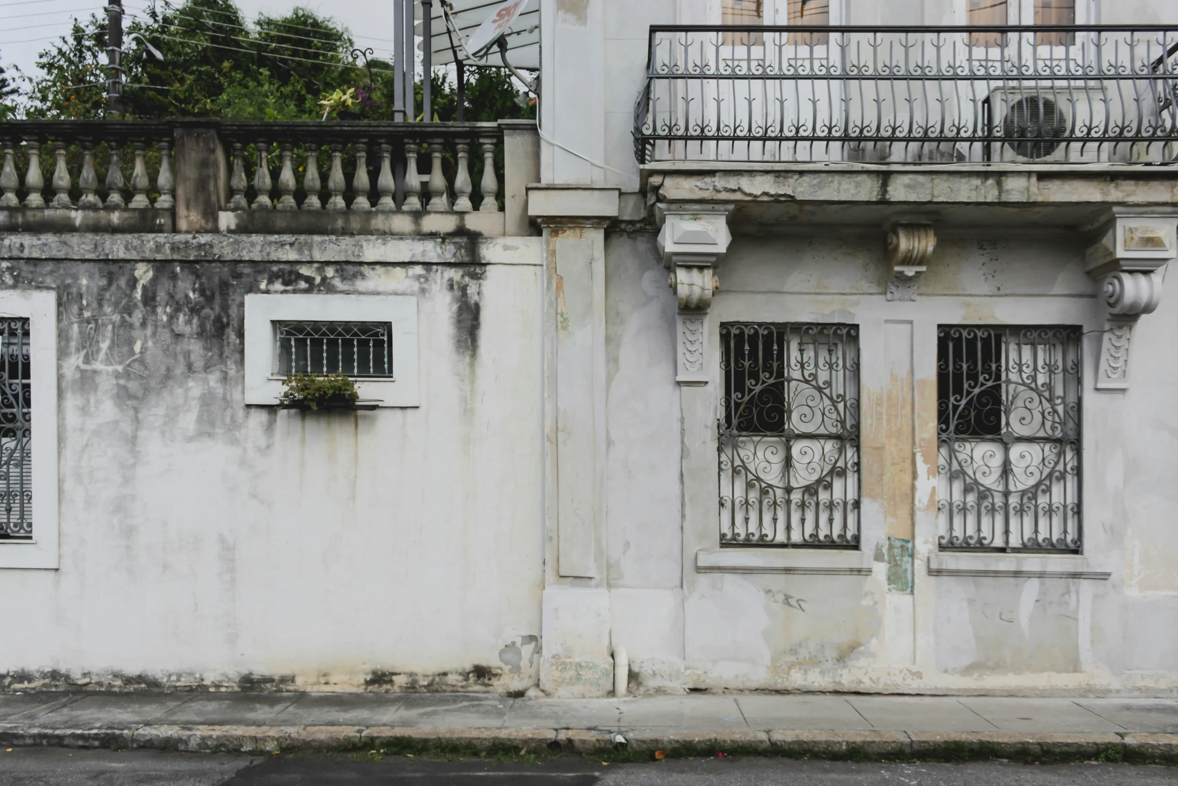 an old building with two doors and balconies