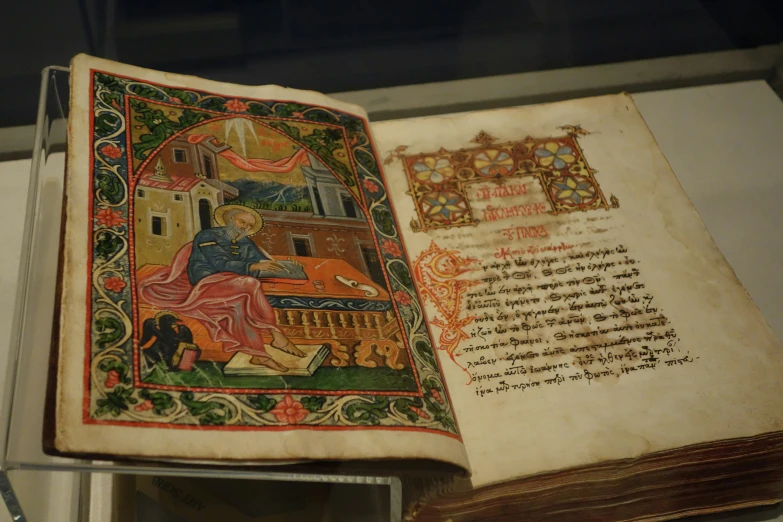 an old medieval book with an open page with a drawing