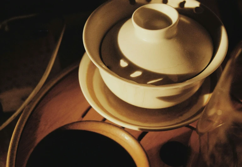 a white and grey tea set on a table