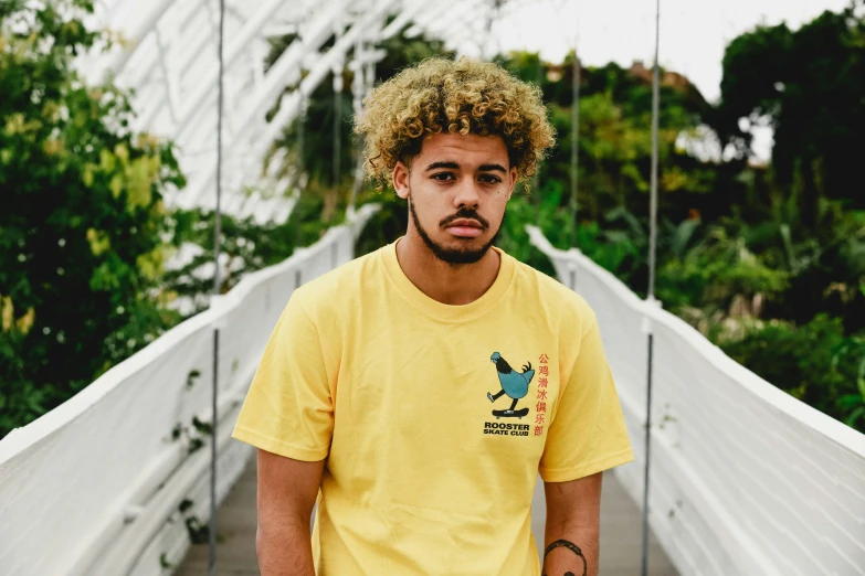 a man that is standing on a bridge