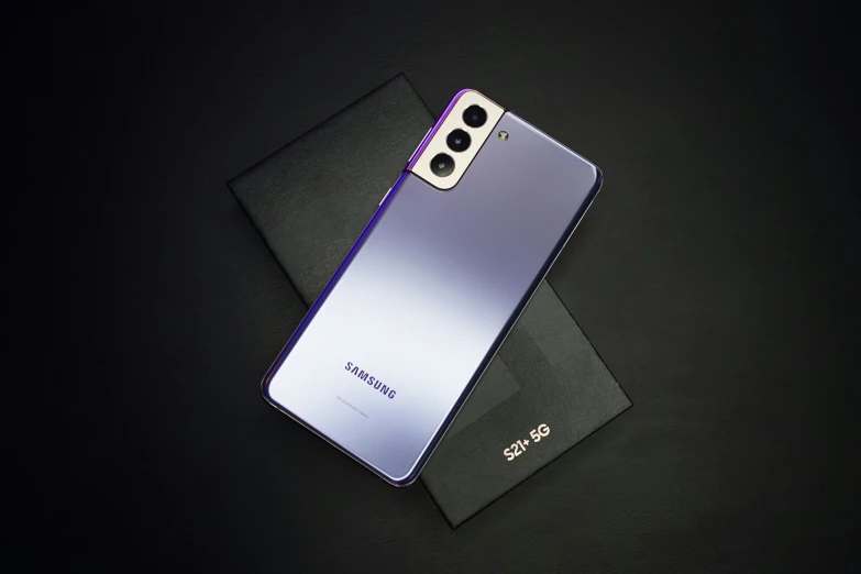 the back side of a silver and purple samsung s20 smartphone