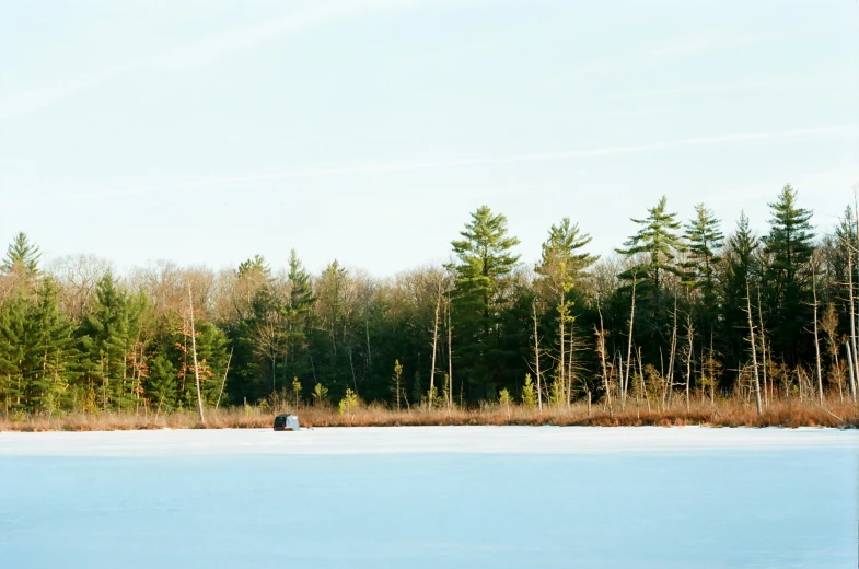 two boats parked on the bank of a lake