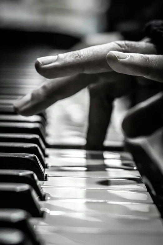 a person is playing on a piano