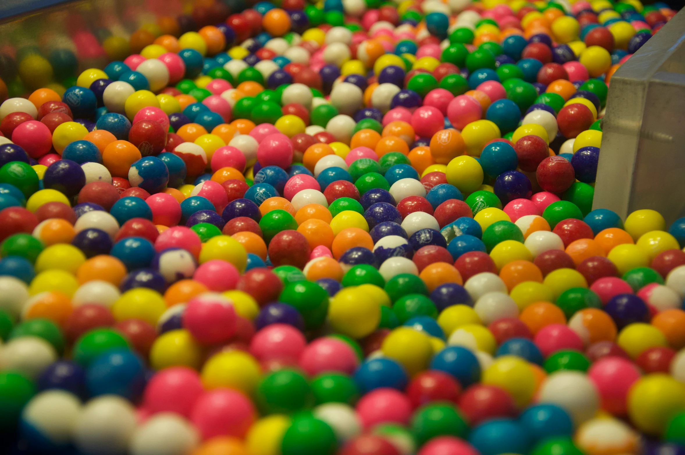 a man in a hat working with candy