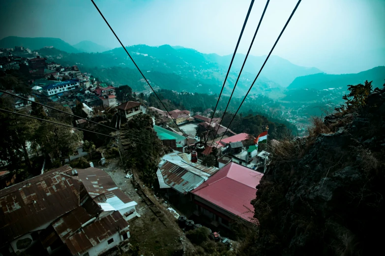 an overhead view of town in the middle of the mountains