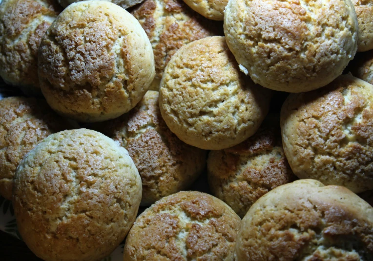 a bunch of fresh baked brown muffins