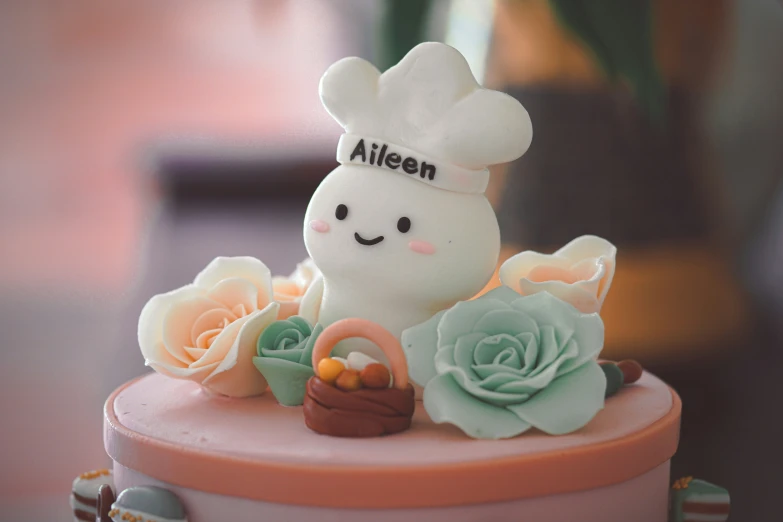 a small cake decorated with an adorable bunny holding a basket