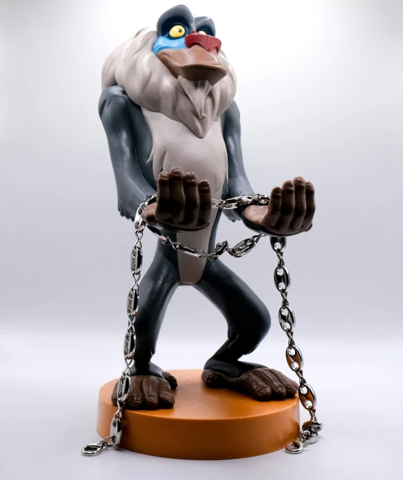 a gorilla  to a stand with chains