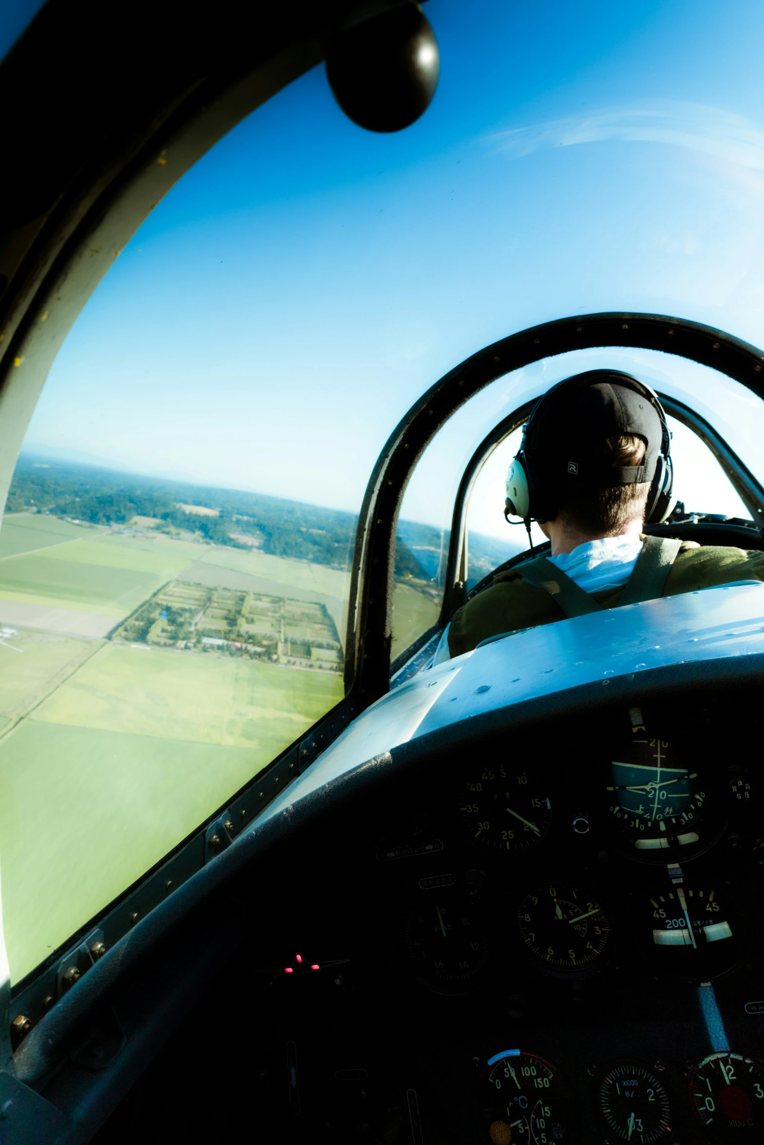 the pilot looks out from his airplane window