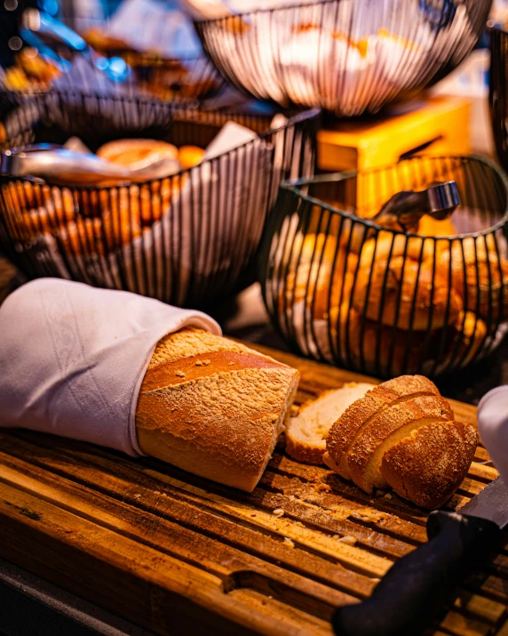 a loaf of bread and some knifes and some baskets