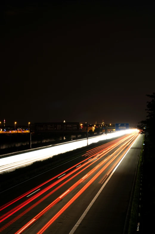 city street at night with street lights and buildings in the background