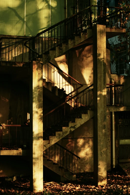 a large staircase in a building is viewed through an open window