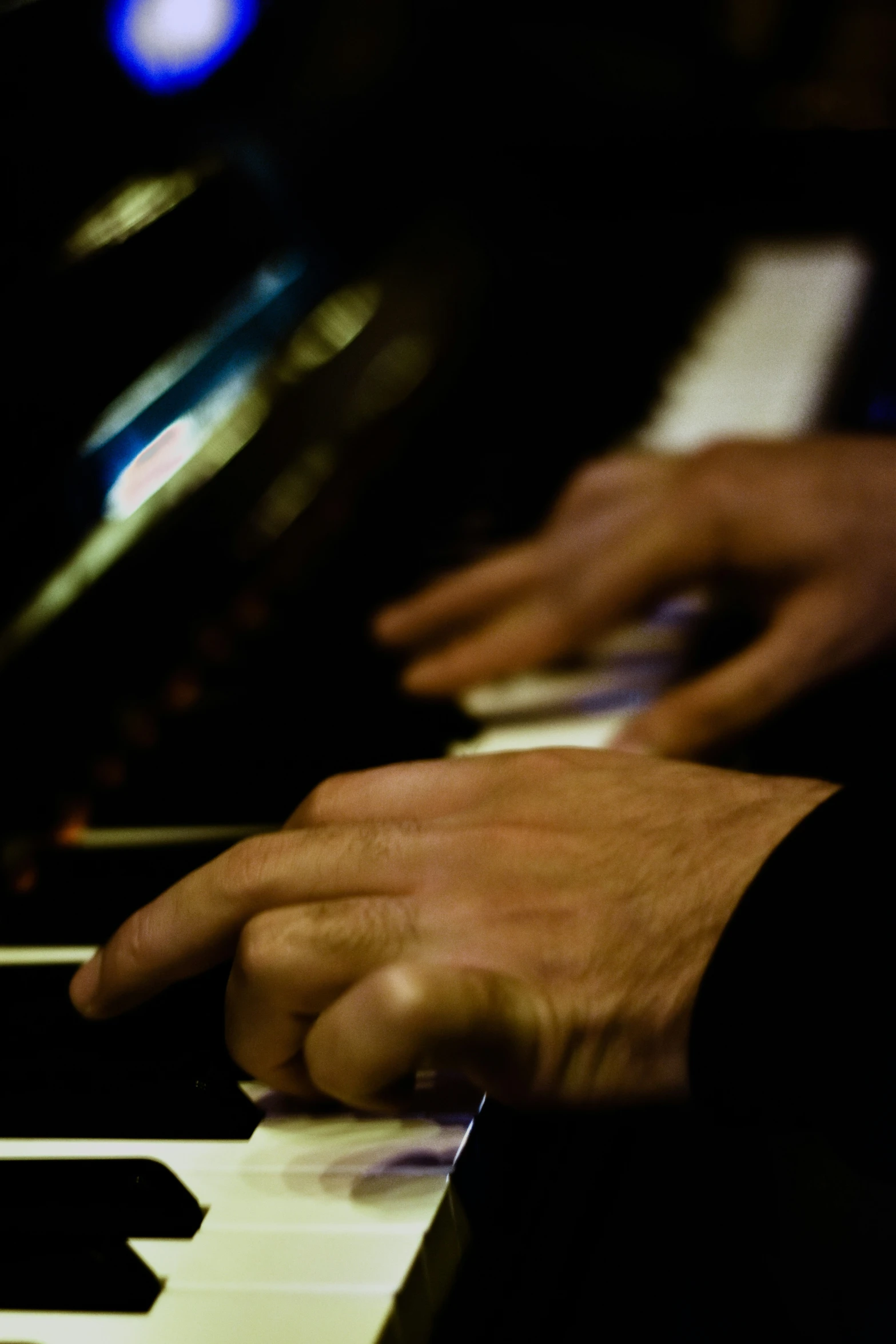 a person playing piano with their hands