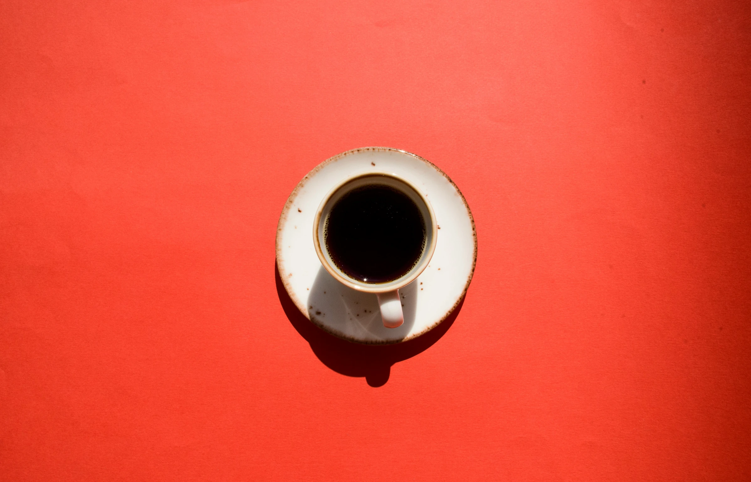 a cup of coffee that has been placed in a small bowl