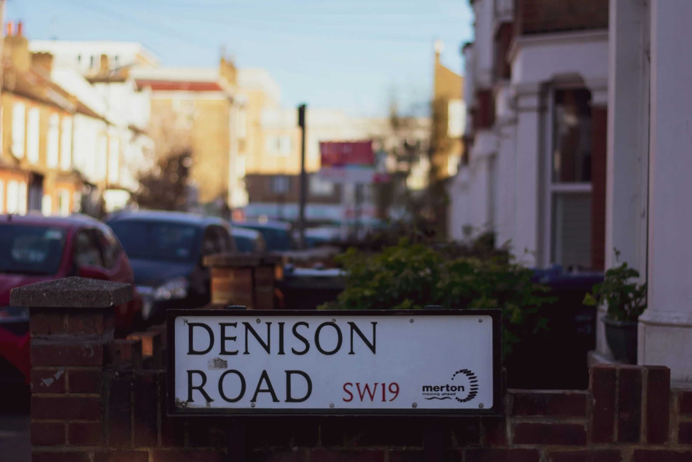 a close up of a street sign near a sidewalk