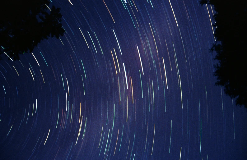 an artistic view of a star trail in the sky