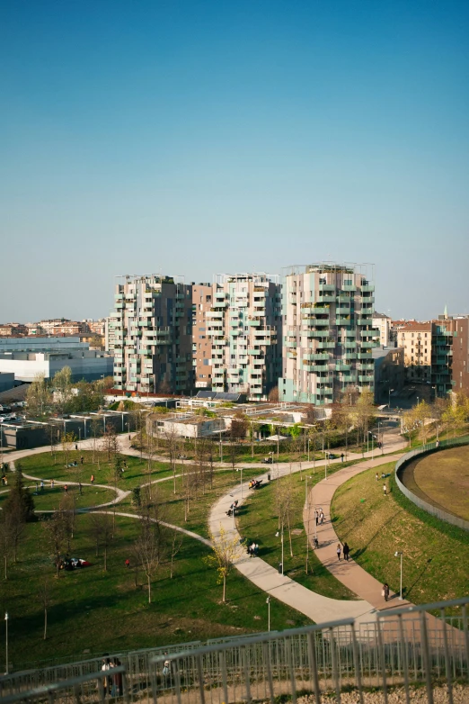 an aerial view of the buildings and grass covered park