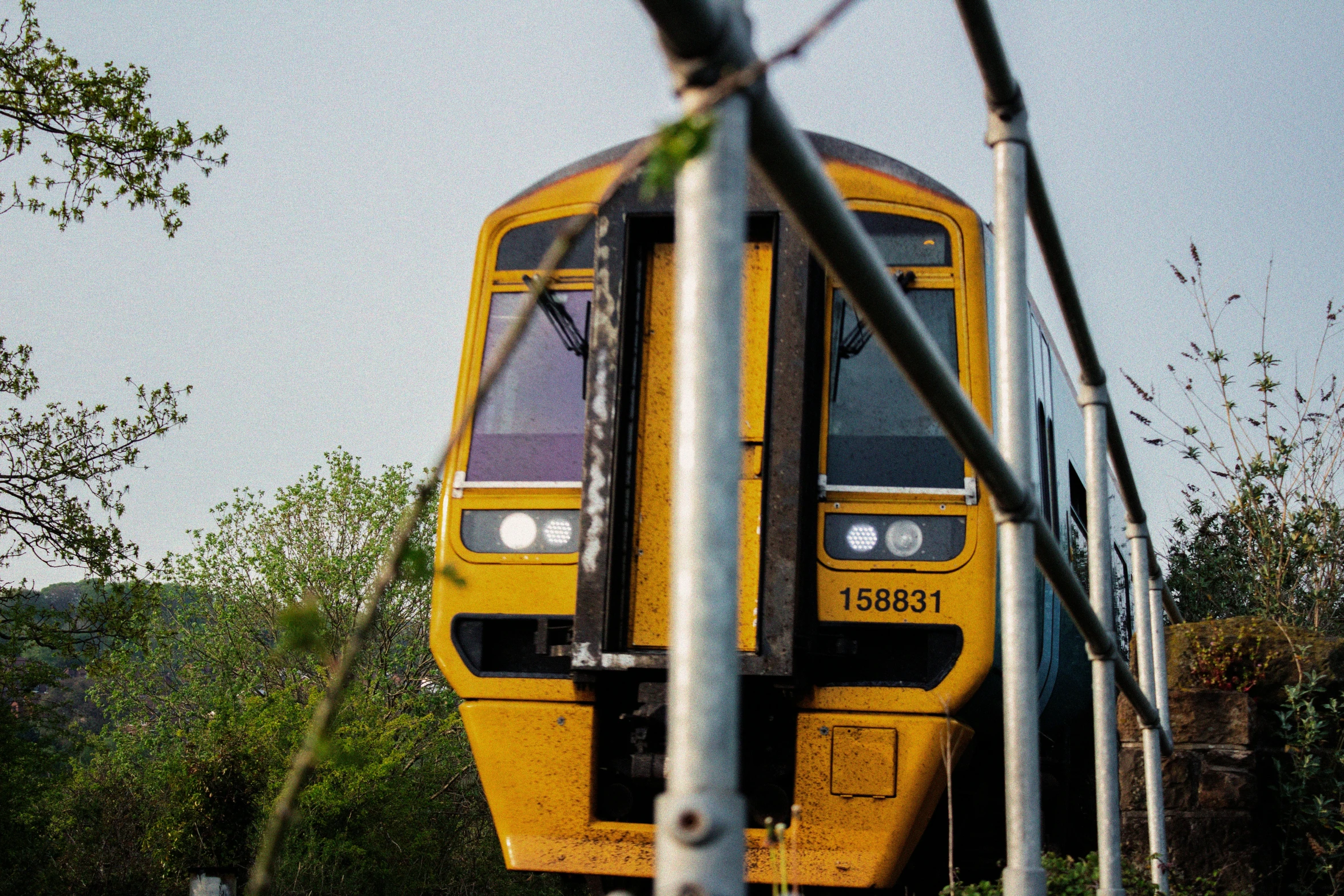 a train is pulling into an abandoned station