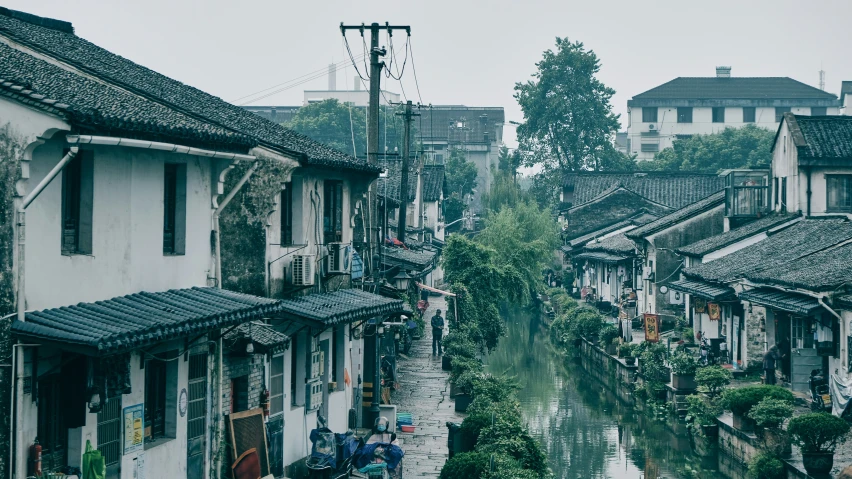 a canal is next to some old style buildings