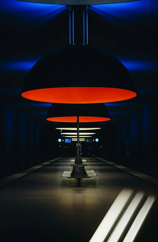 a bright hanging lamp in a dark space
