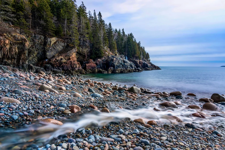 an ocean view looking across a rocky beach at the shore