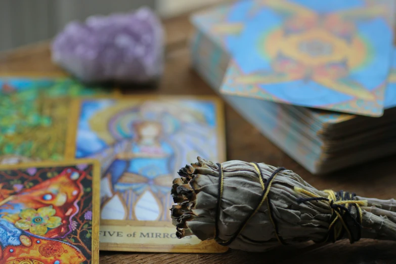 a tarot, taro and cards on top of a table