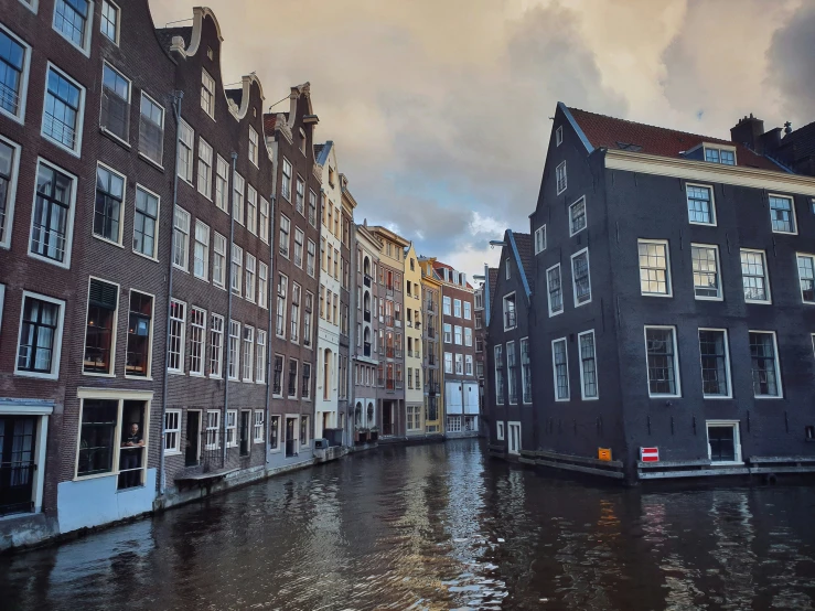 a row of old houses and a canal