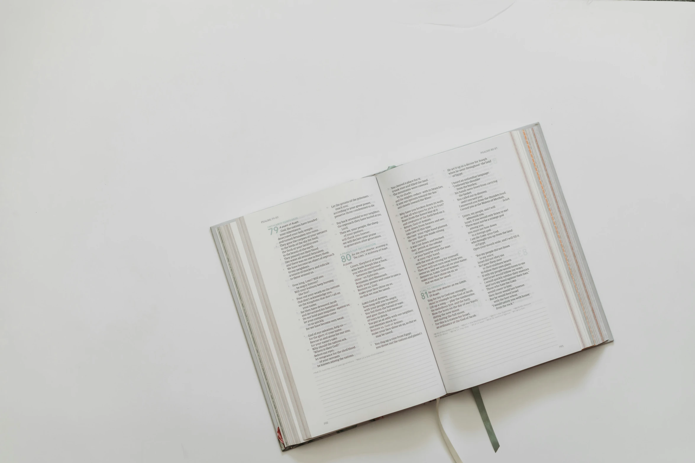 a book opened to the text on a table