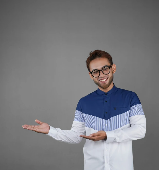 a man in a shirt is holding his hands out