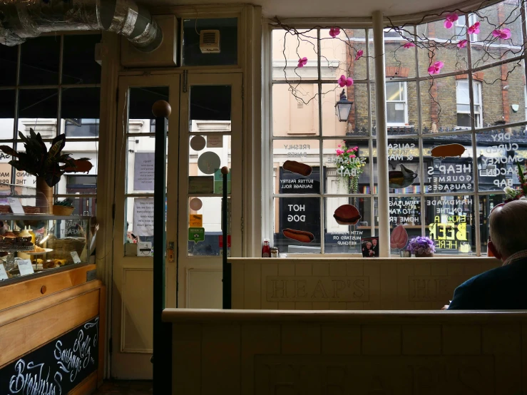 a window at an italian restaurant filled with pastries and desserts