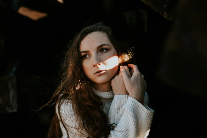 a woman is posing for a po with her light on