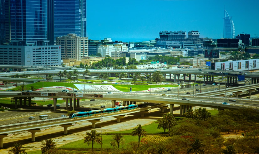 view of a freeway with cars and buildings in the background