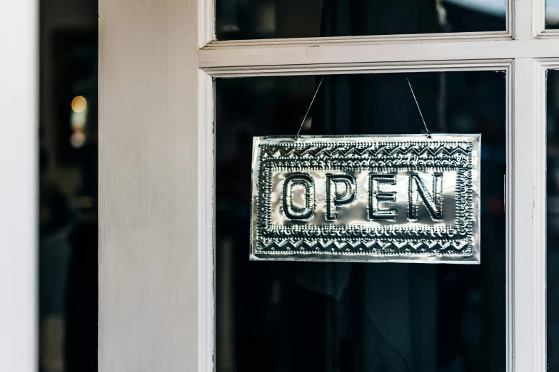 an open sign on a door in a building