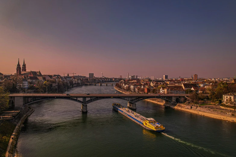 boats on water near a city and bridge