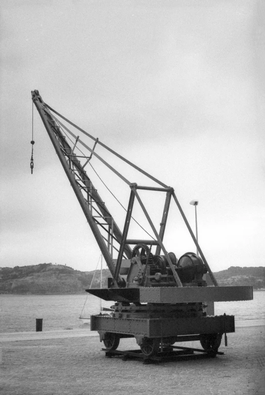 a crane lifting heavy equipment onto the ground