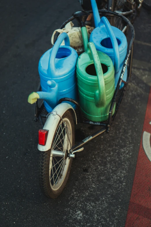 a scooter with a few jugs and a moped