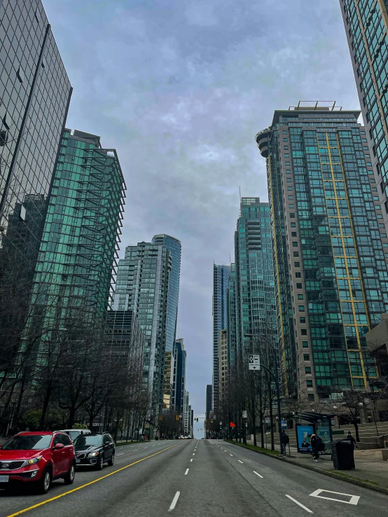 a street with a number of cars driving down it