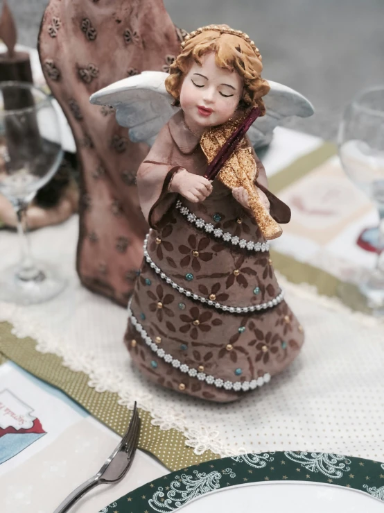 a table with a doll on it and a plate