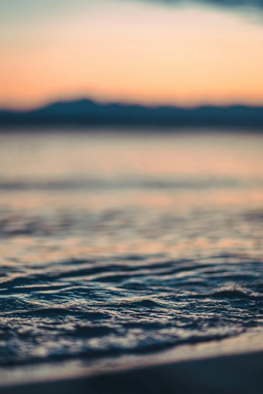 the horizon and sea is reflected on the surface of water